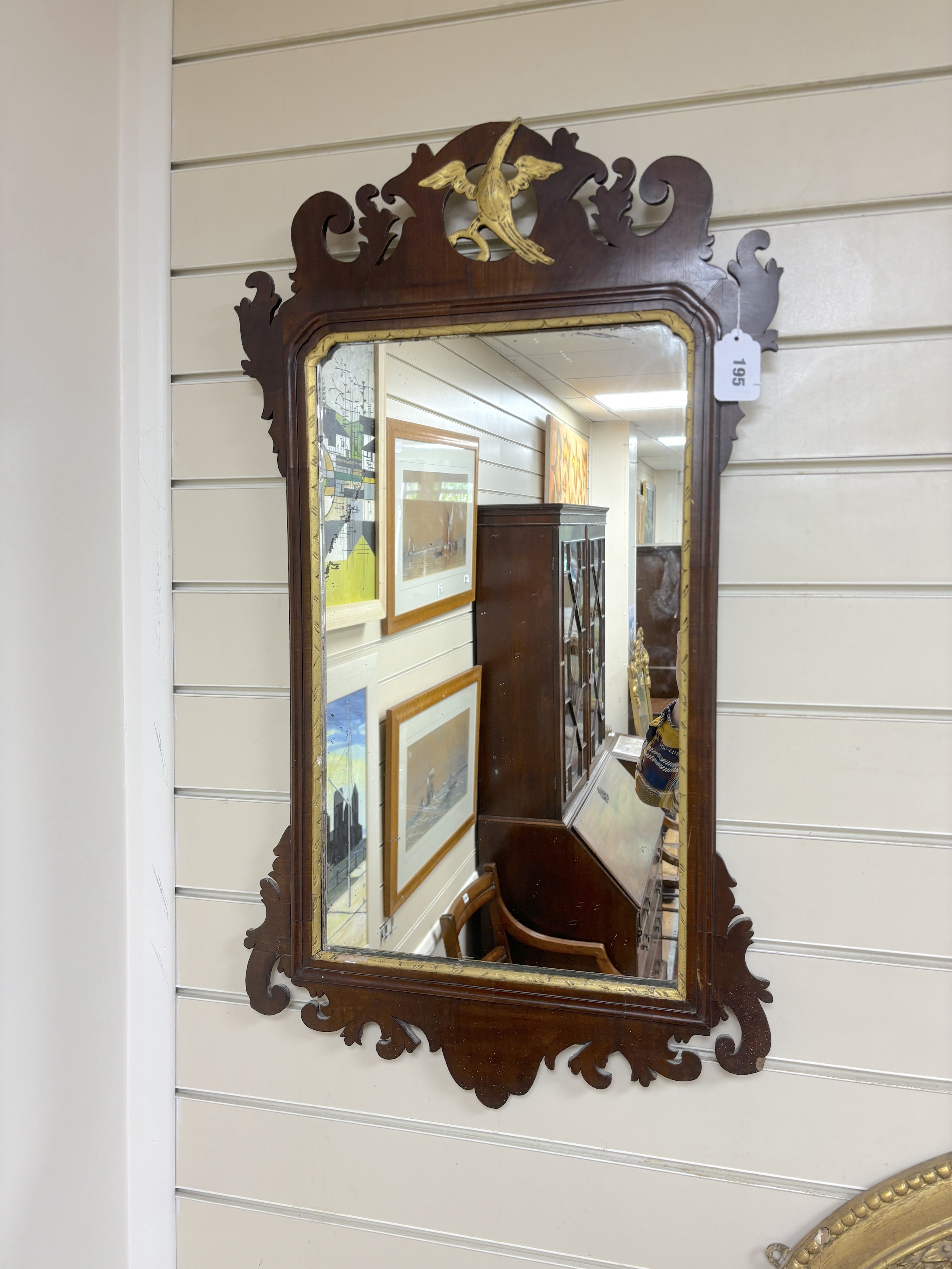 A George III style mahogany fret cut wall mirror, width 47cm, height 86cm